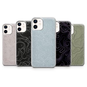 May include: Five phone cases with topographic map designs. The cases are in various colors, including light blue, black, and olive green. The cases have a glossy finish and are designed to fit a smartphone.