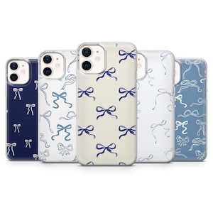 Peut inclure: Plusieurs coques de téléphone avec des motifs de nœuds. Les coques présentent une variété de couleurs, notamment bleu marine, blanc et bleu clair. Les nœuds sont d'un bleu foncé contrastant.