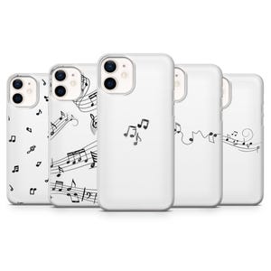 May include: A collection of five white phone cases with musical note designs. The cases feature various patterns, including scattered notes, musical staffs, and stylized musical symbols in black.