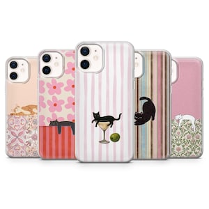 May include: A collection of phone cases with various cat-themed designs. The cases feature illustrations of cats in different poses, including lounging and playing. Designs include pink stripes, floral patterns, and a cat with a martini.
