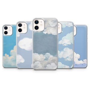 May include: A collection of five phone cases with a sky and cloud design. The cases feature a variety of cloud formations against a light blue background. The cases are made of a clear material.