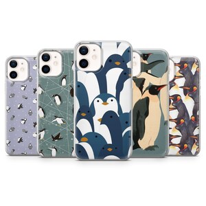 May include: A collection of five phone cases with various penguin designs. The cases feature different patterns, including a cluster of blue and white penguins, and other cases with penguin illustrations on a light background.