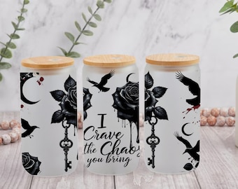 May include: Three frosted glass tumblers with bamboo lids. Each tumbler features a black rose, key, raven, and crescent moon design. The text "I crave the chaos you bring" is printed on one tumbler.