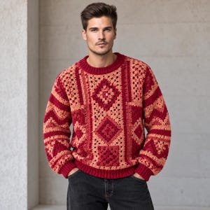 May include: A long-sleeve crochet jumper featuring a patchwork design of deep red and light peach yarn. The garment has a crew neckline, ribbed cuffs, and a ribbed hem, constructed with square and triangular motifs in a repeating geometric pattern.