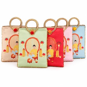 May include: A collection of five rectangular satin handbags in beige, light green, red, pink, and light blue. Each bag features a circular gold-toned handle with a small pom-pom and an embroidered illustration of a person sitting on a stool.