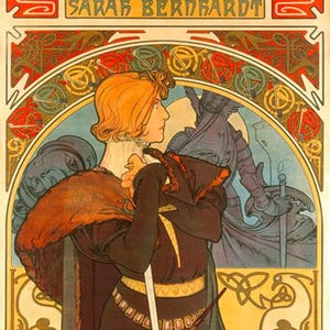 May include: Art Nouveau poster for the play "Hamlet" featuring Sarah Bernhardt. The poster has a warm color palette with a central figure in a dark brown costume holding a sword. The text at the top reads "Tragique Histoire D'Hamlet, Prince De Danemark".