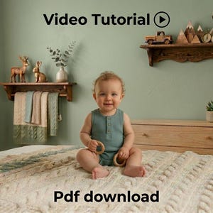 May include: A baby in a teal onesie sits on a cream-colored cable knit blanket, holding wooden rings. A shelf above holds decorative items. The text "Video Tutorial" and "Pdf download" are visible.