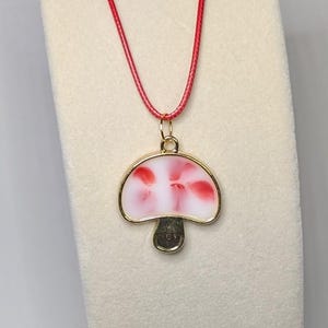 Red and white mushroom pendant