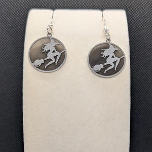silver and black witch earrings