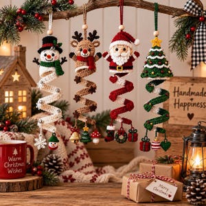 May include: Four hanging crochet ornaments featuring a snowman, a reindeer, Santa Claus, and a Christmas tree. Each figure is attached to a spiraling crochet tail decorated with small festive charms like snowflakes, bells, gifts, and wreaths.
