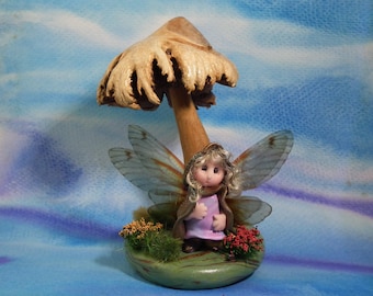 Winged Spry-Gnome 'Flurry' 2" on flowery tussock with wood rose toadstool overall 4" Sculpture Artist Ann Galvin