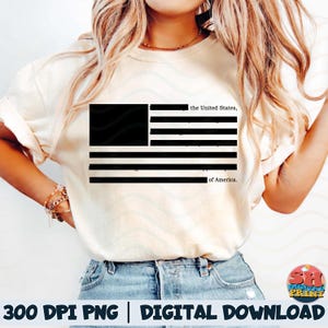 May include: Cream-colored t-shirt featuring a black and white American flag design. The flag includes the text "the United States, of America." The shirt is part of a digital download collection.