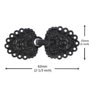 May include: Black metal hook and eye closure with a floral design. The closure measures 2.5 inches tall and 2 1/3 inches wide.