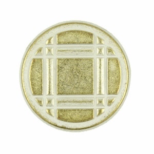 May include: A round, white and gold decorative button with a geometric design.