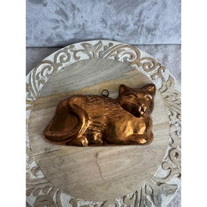 May include: A rustic wooden sign with the text "Welcome to our home" in white lettering. The sign features a distressed finish and a simple, inviting design, perfect for entryway decor.
