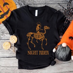 Halloween Western T-Shirt, Night Rider Shirt, Skeleton Cowboy Shirt, Horse Skeleton Shirt, Country Halloween Gifts, Halloween Rodeo Shirt