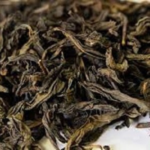 May include: Loose dried black tea leaves, a popular beverage enjoyed for its flavor and health benefits.