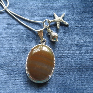 Carnelian pendant with nautical starfish and fish charms, oval carnelian necklace, 24 inch silver snake chain