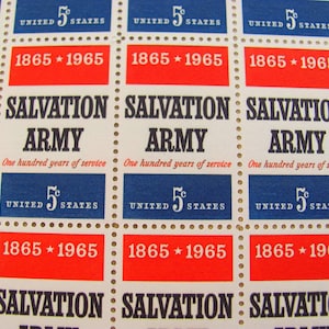 May include: A sheet of vintage United States postage stamps commemorating the Salvation Army's 100th anniversary in 1965. The stamps feature the Salvation Army logo and the text "Salvation Army" in black lettering. The stamps are blue, red, and white.