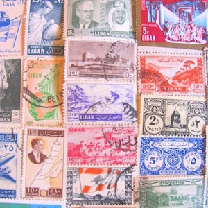 May include: A collection of vintage postage stamps from Lebanon. The stamps feature various designs, including a map of Lebanon, a building, a cedar tree, and a portrait of a man. The stamps are in various colors, including red, blue, green, and yellow.