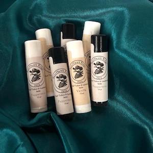 May include: A collection of six lip balms in various flavors, including peppermint and vanilla. Each balm is labeled with the brand name "Razr Hawk Ridge" and the year "2024".