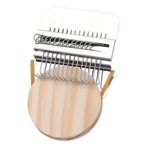 May include: A silver-colored weaving tool with multiple hooks and a wooden base. The tool has a rectangular top with evenly spaced slots and a series of curved hooks below. Two rubber bands secure the wooden base to the metal frame. The wooden base is a light brown color.