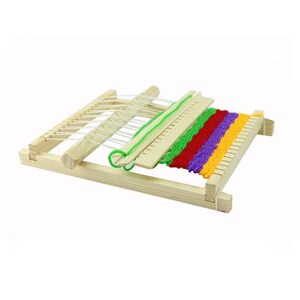 May include: A wooden weaving loom with white string and colourful yarn in green, red, purple, and yellow. The loom is rectangular with a series of pegs and a wooden shuttle. This craft tool is designed for weaving projects.