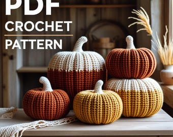 May include: A collection of crocheted pumpkins in various sizes and colors, including orange, yellow, and cream. The pumpkins are arranged on a wooden table. The image also features the text "PDF CROCHET PATTERN".