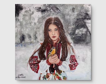 Beautiful Ukrainian lady in national dress with a bird.