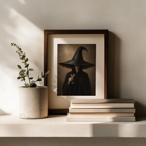 Vintage-inspired witch holding glass digital wall art for seasonal gallery display — eerie muted palette