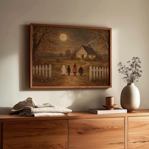 Trick-or-treating children in costumes walking toward glowing farmhouse wall art for autumn living room — vintage spooky-cute aesthetic