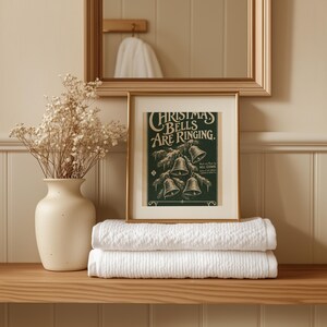 Vintage Christmas bells sheet music poster wall art for living room with snowy pine branch and gold accents