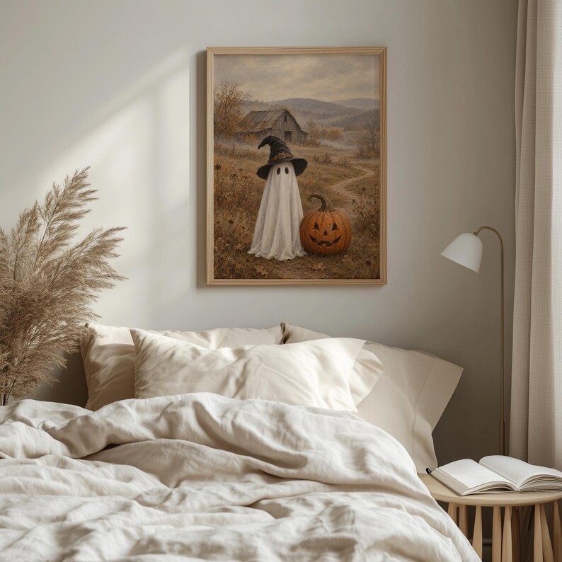 Textured vintage Halloween printable artwork with ghost in witch hat and jack-o'-lantern surrounded by misty countryside aesthetic