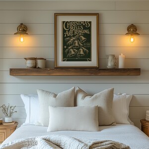 Retro bell illustration poster featuring snowy pine branch and aged sheet music layout for holiday home displays