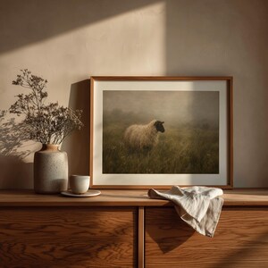 Black-faced sheep printable art for farmhouse — moody rural landscape with muted green and cream tones