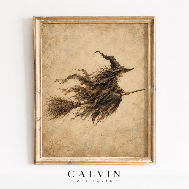 May include: A framed wall art print featuring a sepia-toned illustration of a witch with long, flowing hair and a pointed hat riding a broomstick. The artwork has a weathered, textured appearance and is enclosed in a simple wooden frame.