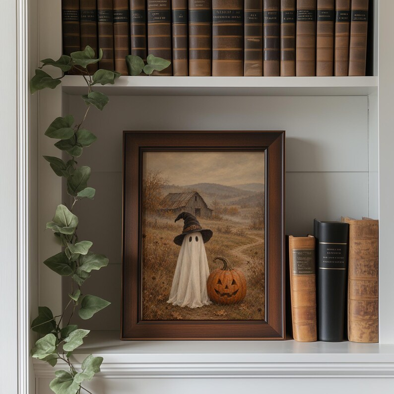 Soft textured vintage autumn poster with sheet spirit and pumpkin lantern in misty farmland landscape