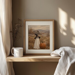 Spooky ghost and pumpkin wall art printable featuring rustic farmhouse autumn landscape with muted tones