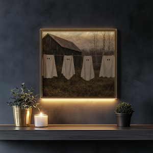 Clothesline spectre poster for Halloween décor — quaint rustic village setting with weathered wooden barn and countryside charm