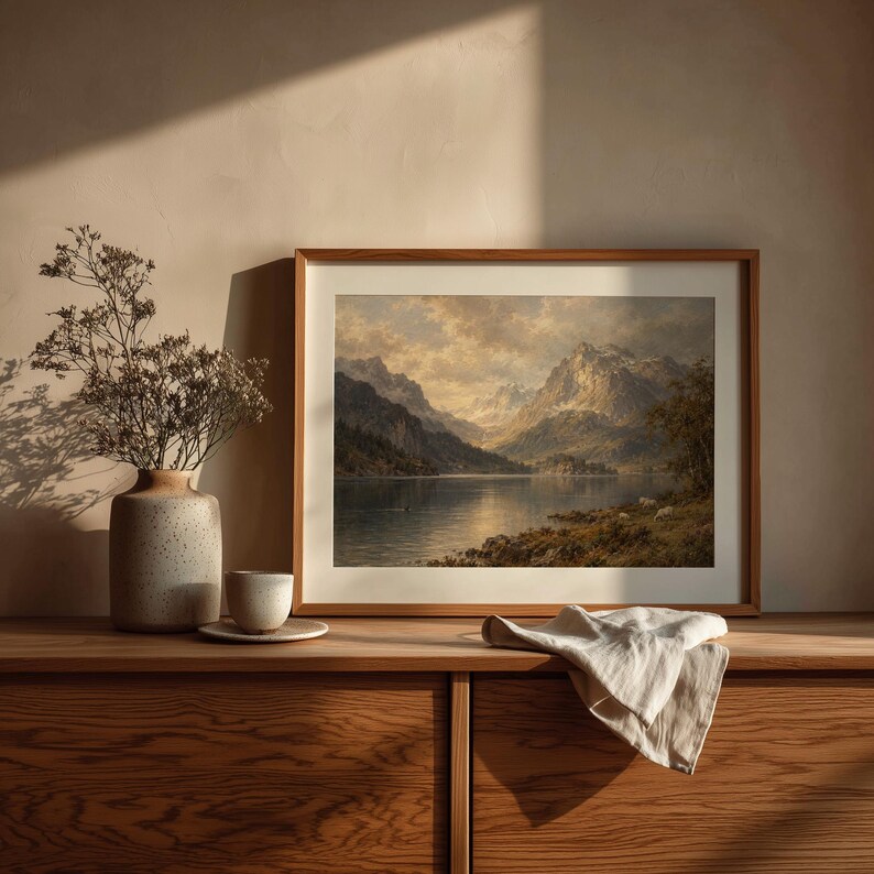 Peaceful mountain lake artwork featuring dense treeline and dramatic lighting — timeless landscape print