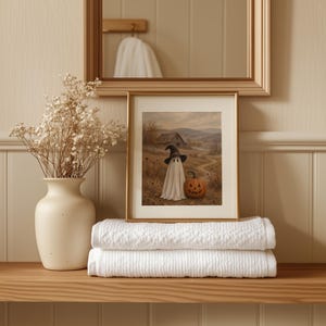 Printable Halloween wall decor featuring cute sheet phantom and pumpkin among dried autumn grasses and country path