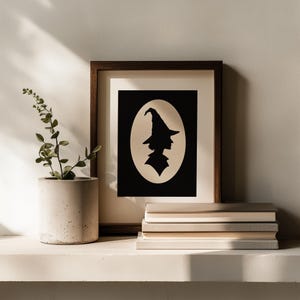 Bewitched character silhouette printable art for Halloween — profile cutout design on cream background with timeless elegance