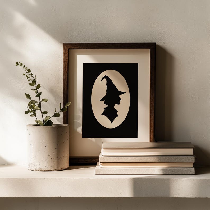 Bewitched character silhouette printable art for Halloween — profile cutout design on cream background with timeless elegance