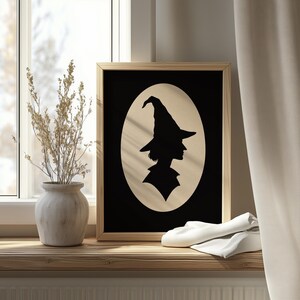 Vintage witch hat profile poster for bedroom — elegant black silhouette graphic wall art with moody seasonal appeal