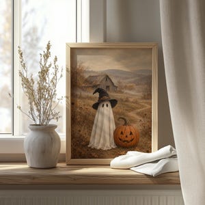 Sheet ghost wearing witch hat printable art for living room — vintage Halloween countryside scene with jack-o'-lantern