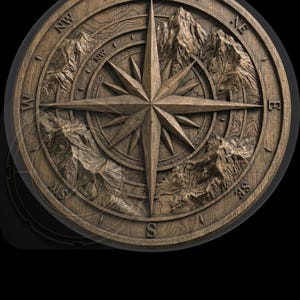 May include: A round, wooden compass rose with a detailed, carved design. The compass features a central star, directional markers (N, S, E, W, NW, NE, SW, SE), and mountain range imagery. The wood has a natural, warm brown tone.
