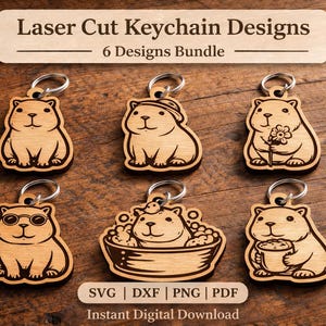 May include: A bundle of six laser-cut wooden keychain designs featuring cartoon capybaras in various poses. The keychains have silver-colored rings and are displayed on a wooden surface. The text "Laser Cut Keychain Designs - 6 Designs Bundle" is at the top.