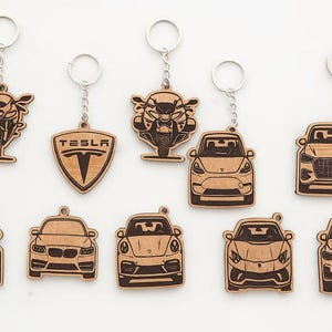 May include: A set of three ceramic mugs with a speckled, matte finish. The mugs are in shades of cream, light gray, and dark gray. Each mug has a simple, minimalist design and a rounded handle.