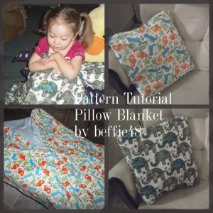 May include: A pillow blanket with a dinosaur and palm tree pattern on one side and an elephant pattern on the other side. The pillow blanket is made of soft fabric and is perfect for cuddling up on the couch.