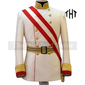 May include: A white military-style jacket with gold buttons, trim, and a red sash. The jacket has a high collar and decorative cuffs. The belt is black with gold trim. The text "The Highland Tailor" is visible on the jacket.
